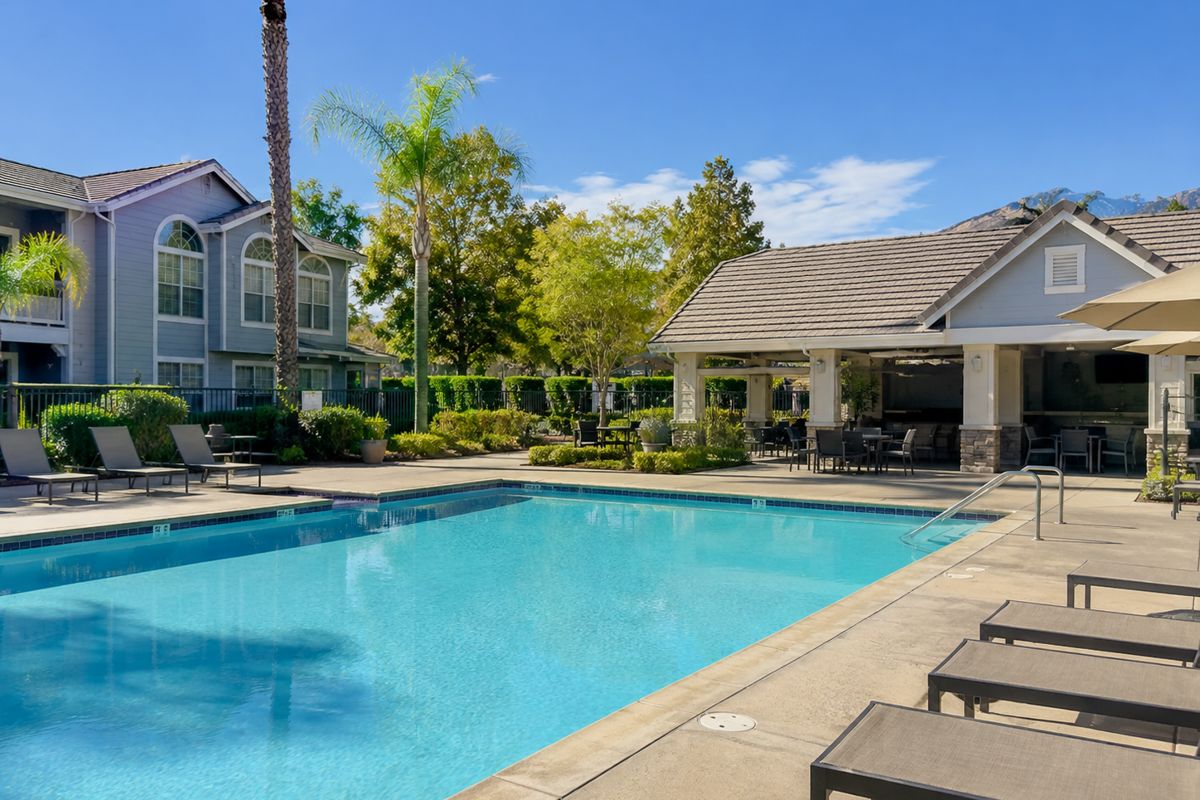 Community pool and clubhouse at a residential complex