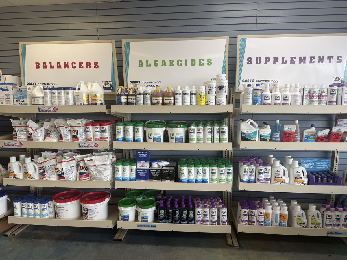 Shelves of balancers, algaecides, and pool chemicals